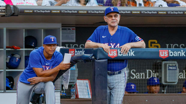 Jul 29, 2023; San Diego, California, USA; Texas Rangers manager Bruce Bochy (15) and associate manager Will Venable (83) watch on as San Diego Padres starting pitcher Yu Darvish (11) pitches during the fifth inning against the San Diego Padres at Petco Park. Mandatory Credit: David Frerker-USA TODAY Sports  